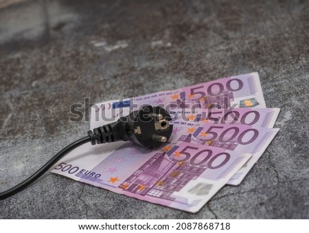 Black electric cable and 500 euro banknotes. expensive electricity Royalty-Free Stock Photo #2087868718