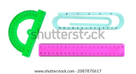 Various plastic school rulers isolated on white background