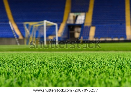 Football stadium, blurred background football goal and tribune