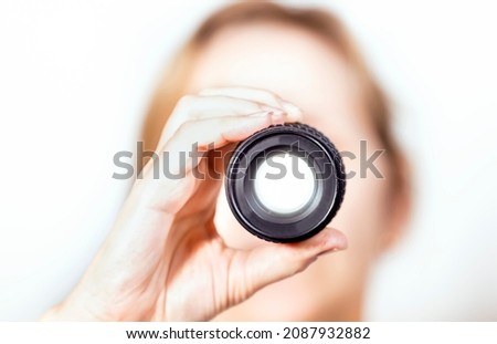 Close-up of hand holding the lens