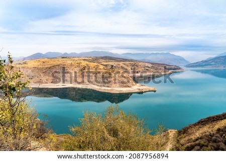 Uzbekistan, the lake Charvak is a water reservoir in the Bostanliq District in the northern part of Tashkent Region Royalty-Free Stock Photo #2087956894