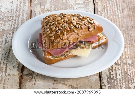 Roast Beef sandwich, roast beef sandwich recipe, wood background white plate  Royalty-Free Stock Photo #2087969395
