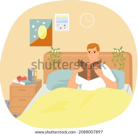 Cute man in pajamas reading literature on his bed comfortably. Book lover concept with young man lying relax on sofa and reading book. Concept of homeward and comfort. Person relaxes after work Royalty-Free Stock Photo #2088007897