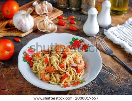 Spaghetti aglio e olio Italian for '"spaghetti [with] garlic and oil"') is a traditional Italian pasta dish from Naples. It is a typical dish of Neapolitan cuisine and is widely popular. Royalty-Free Stock Photo #2088019657