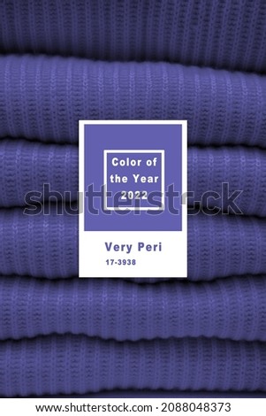 Handmade knitting wool texture background. New 2022 trending PANTONE 17-3938 Very Peri color