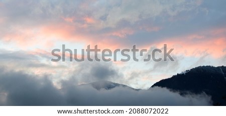 Sunset with cloudy Alps after a rainy day
