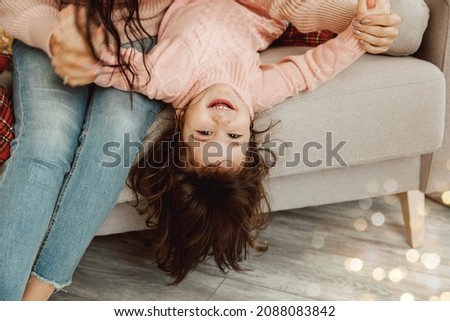 Loving mother laughing, hugging smiling cute child daughter, happy family, having fun playing, feel joy, hugging Royalty-Free Stock Photo #2088083842