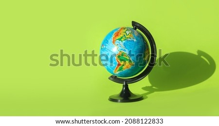 Earth globe isolated on green background. Physical map of North and South America.