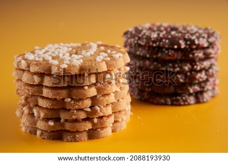Festive biscuits for Christmas, closeup on yellow background