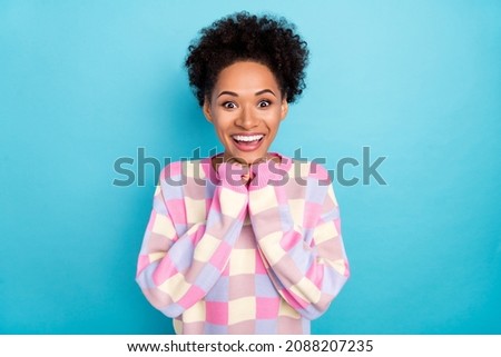 Portrait of attractive girlish amazed cheerful wavy-haired girl great news reaction isolated on bright blue color background