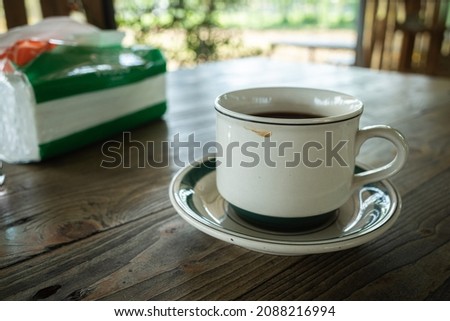black coffee served in a white cup