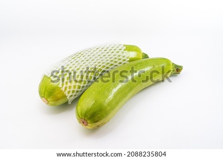 Fresh zucchini on pure white background