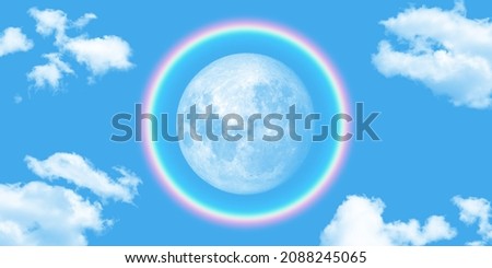 round rainbow around the full moon. beautiful blue  sky background and clouds. picture for stretch ceiling decoration