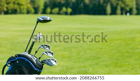 Golf clubs in a golf bag isolated. Set of golf clubs for a golfer. Copy Space. green Background. Close-up. High quality photo Royalty-Free Stock Photo #2088266755