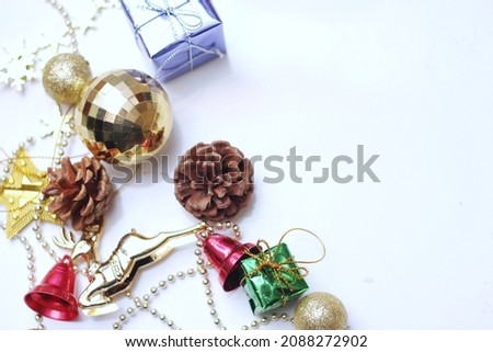 Christmas decorations placed on a white background