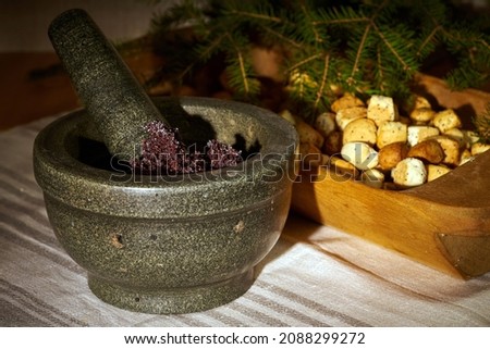 Preparation Poppy milk. Poppy seeds are crushed with a pestle in a mortar. Poppy milk (aguonpienis) is a traditional Lithuanian drink one of the 12-dishes in Kucios - traditional Christmas Eve dinner.