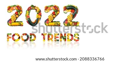 Food trends of New year 2022. New Year 2022 made of vegetables, fruits and fish on white background. Number 2022 of healthy food. 2022 resolutions,  balanced food, sustainable, healthy food concept
