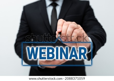 Hand writing sign Webinar. Internet Concept defined as seminar conducted over the Internet Web conferencing Presenting New Technology Ideas Discussing Technological Improvement Royalty-Free Stock Photo #2088371059