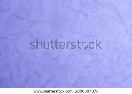 Leaves texture pattern background, natural lush foliages. Toned in color of the year 2022, very peri. selective focus Royalty-Free Stock Photo #2088387076