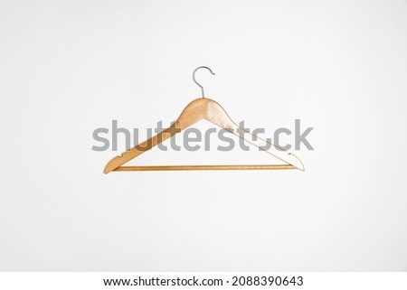Wooden hanger with metal hook isolated on white background.High resolution photo.Top view. Mock-up.
