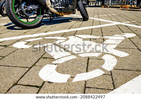 sign for a motorbike parking area - photo