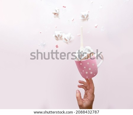 white meringue cookies flying over pink background. Levitation trend photo. Copy space. Sweet baking and cooking concept. High quality photo