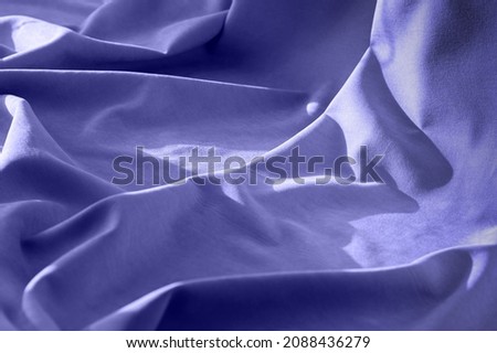 Linen fabric with pleats. Abstract textile background. Color of the year 2022 Very Peri. Royalty-Free Stock Photo #2088436279