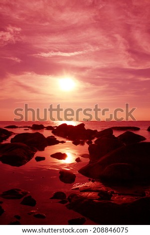Sunset on the stone beach in Thailand
