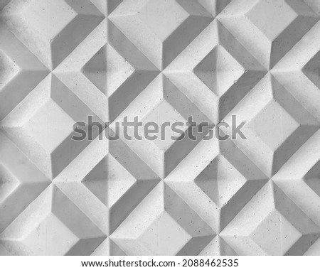 Background texture of square 3d white tiles on facade. Street stone cement wall with geometric rhombus pattern, concrete light gray polygons. Building cladding, architectural masonry Royalty-Free Stock Photo #2088462535