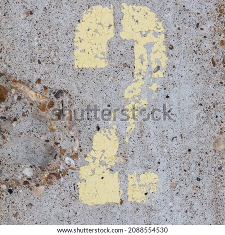 The number 2 is painted in yellow on the concrete wall.