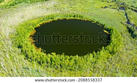 Aerial view of Bottomless  Lake in forest of Solnechnogorsk District, Moscow region. Russia. Aerial view. The lake is perfectly round and its depth is not determined.