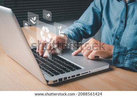 ESG environment social governance investment business concept, Businesswoman hand using laptop with ESG icon on screen display, social and corporate governance concept