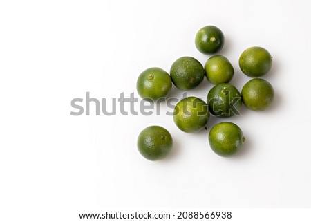 Green lime citrus fruits isolated on white background
