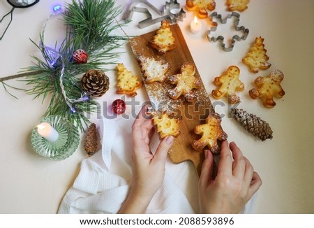 christmas bakery in shape of fir trees, gingerbread. New year decorated background. home related. cozy picture. food art.           