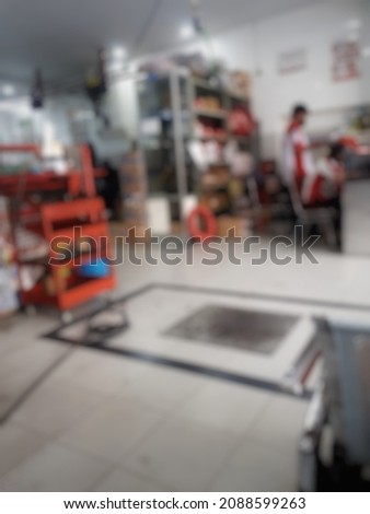 Defocused abstract background of The Machine Shop. Perfect for background, wallpaper, template and other.