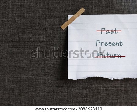 Torn note paper on dark background with text PAST PRESENT FUTURE, and choose PRESENT only, concept of living with present moment only, let go of past and not waiting for future Royalty-Free Stock Photo #2088623119