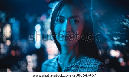 Beautiful Asian Female Portrait Standing on City Street with Neon Lights Late in the Evening. Authentic Adult Confident Woman Posing For Camera, Smiling in the Night on Downtown Business Street. Royalty-Free Stock Photo #2088647467