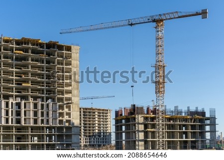 Photo of the construction site and building of high buildings and cranes in the city. Constructional concept.