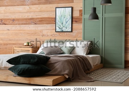 Interior of stylish room with comfortable bed
