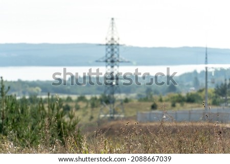 Power lines passing through huge distances to transmit electricity to the end user. Support of an overhead power line.