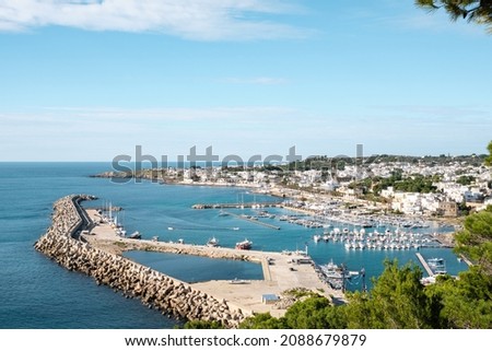 View of the marina with boats moored in Santa Maria di Leuca Mediterranean town in southern Italy on a sunny winter day in December. Royalty-Free Stock Photo #2088679879
