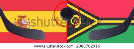Top view hockey puck with Spain vs. Vanuatu command with the sticks on the flag. Concept hockey competitions