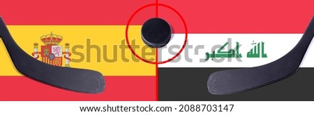 Top view hockey puck with Spain vs. Iraq command with the sticks on the flag. Concept hockey competitions