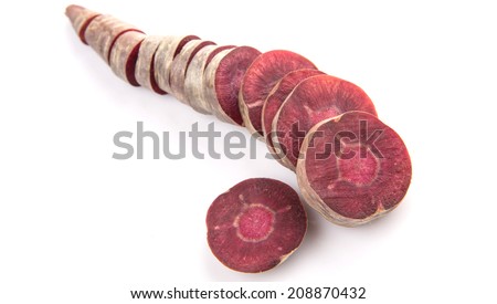 Chopped purple carrot over white background