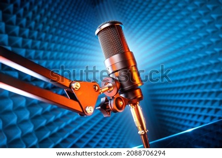 microphone in recording studio on blue background