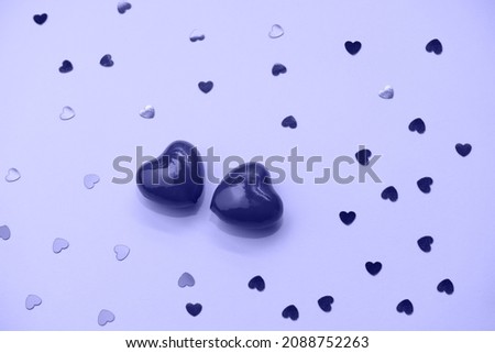 Love emotion. Hearts confetti and two hearts. Valentines day concept.  Pantone Very peri color trend 2022