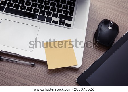 Modern desk with laptop and tablet Royalty-Free Stock Photo #208875526