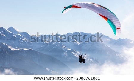 paraglider in the bernese alps.In the background mountain peaks of Eiger, Moench and Jungfrau, Switzerland
 Royalty-Free Stock Photo #2088761881