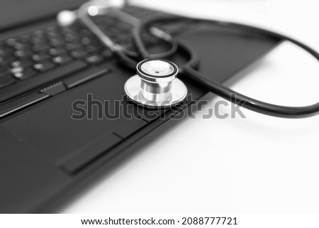 Stethoscope and computer with copy space for text.White background.Closeup.
