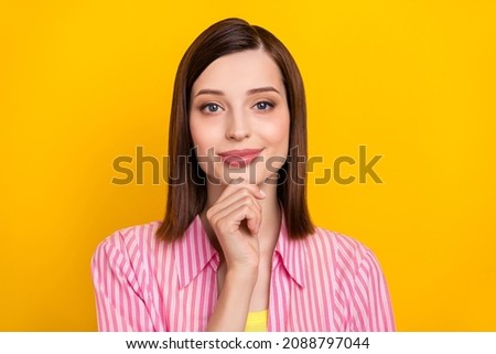 Photo of satisfied candid person arm touch chin look camera minded creative isolated on yellow color background
